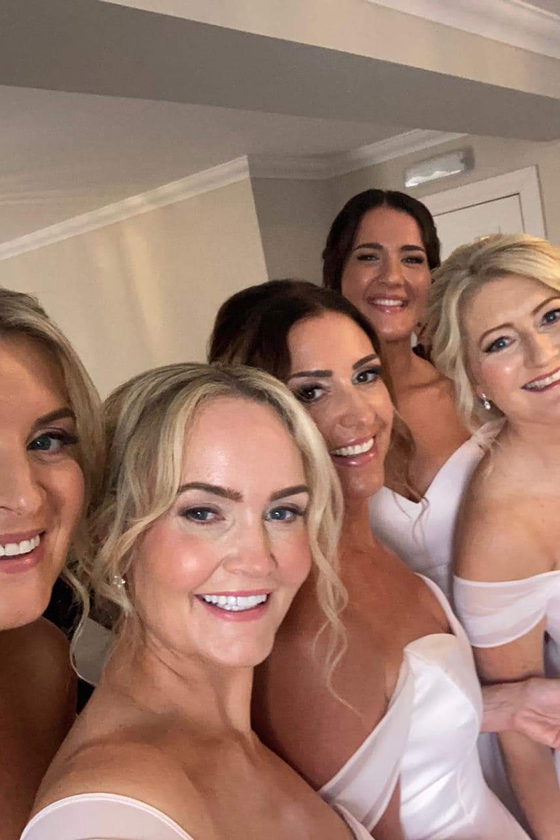 Brides smiling with fresh, glowy makeup